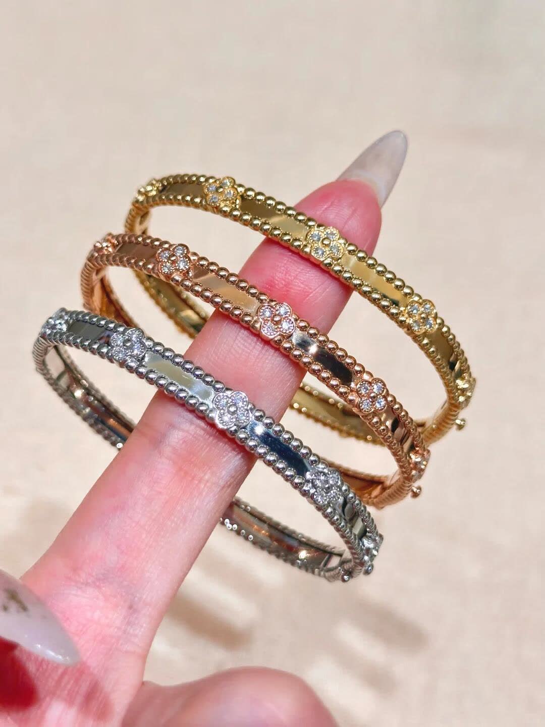 Van Cleef & Arpels Elegant Gold and Silver Bracelets Set